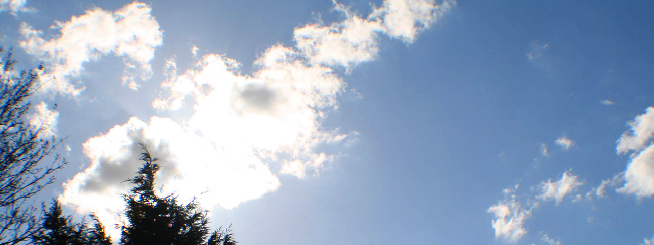 A photo of a blue sky with light clouds.